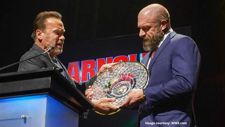 WWE COO Triple H receives lifetime achievement award from Arnold Schwarzenegger WWE