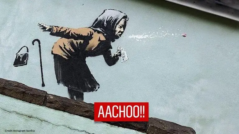 Banksy's new sneezing woman mural appears in Bristol's Vale Street famous for steep roads Banksy