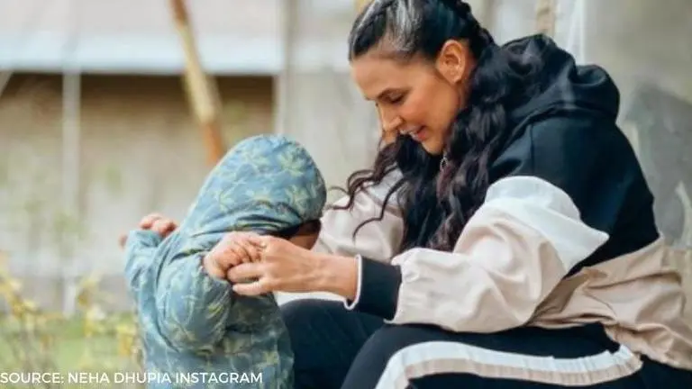 Neha Dhupia enjoys her evening with 'baby girl' Mehr and a 'herd of horses'; watch Neha Dhupia