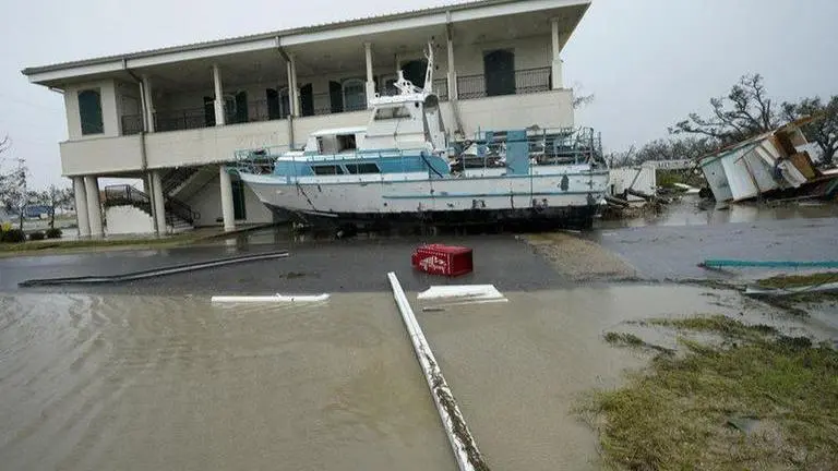 Trump visits Louisiana neighbourhood hit by Laura