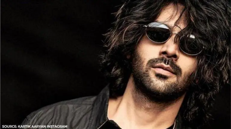 Kartik Aaryan shares a monochrome pic asking fans if he can do a hair and toothpaste ad Kartik Aaryan