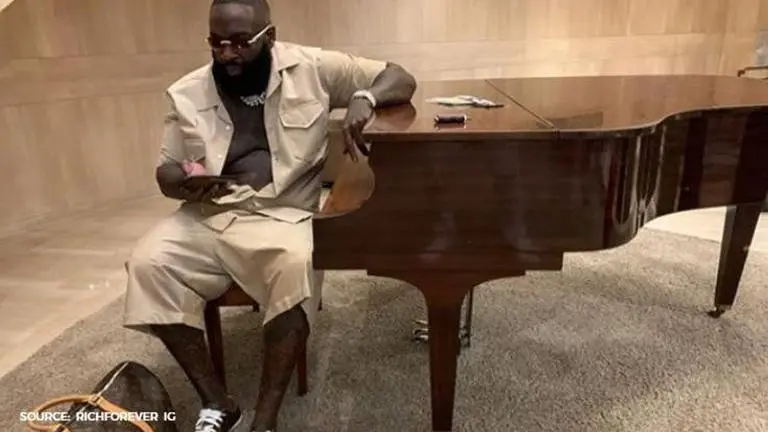 Rick Ross gets called out by followers for sporting fake Louis Vuitton clothes and luggage Rick Ross