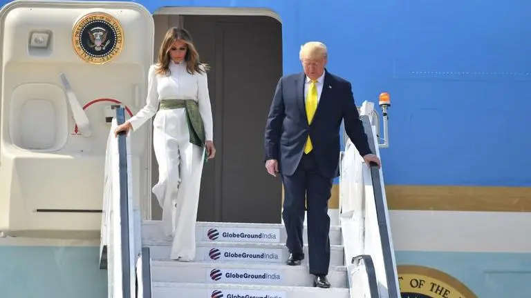 White jumpsuit and green sash, Melania pays tribute to Indian textiles