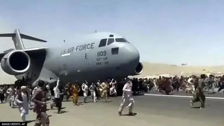 Chaos at Hamid Karzai Airport as thousands attempt to flee Afghanistan after Taliban siege Kabul airport