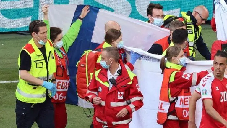 Finland fans throw flags to hide Christian Eriksen, chant his name after collapse | Video Denmark Vs Finland, Eriksen injury, Christian Eriksen collapse, Christian Eriksen CPR, Eriksen video, Christian Eriksen injury video, Christian Erikse