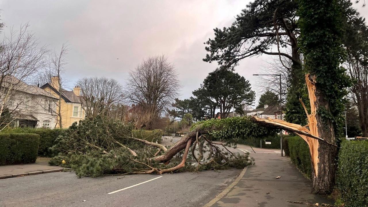 A fierce storm is lashing Ireland and Scotland with record winds, downing power lines