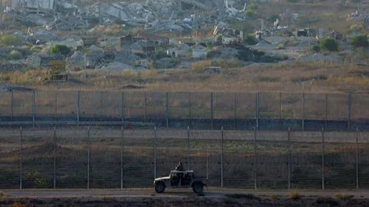 A military jeep patrols the Israeli side of the Israel-Gaza border, amid the Israel-Hamas conflict, in Israel 