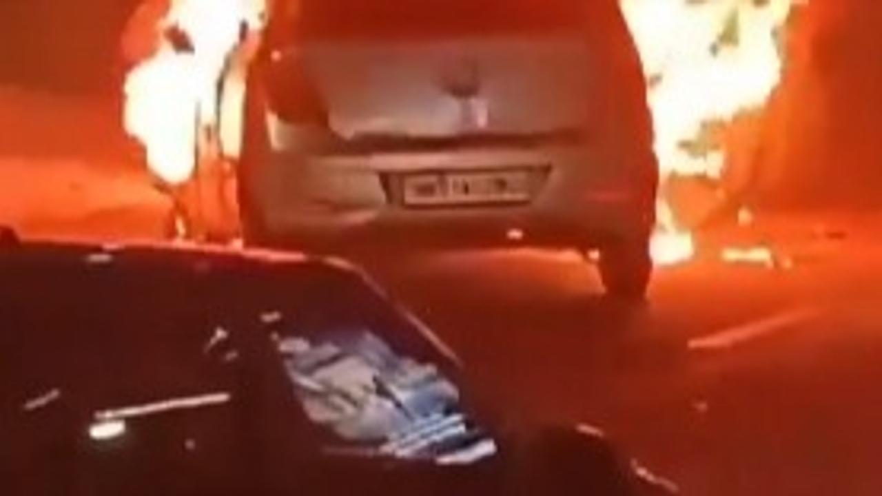  A moving car caught a massive fire in the middle of the road in Noida's Sector 49. 