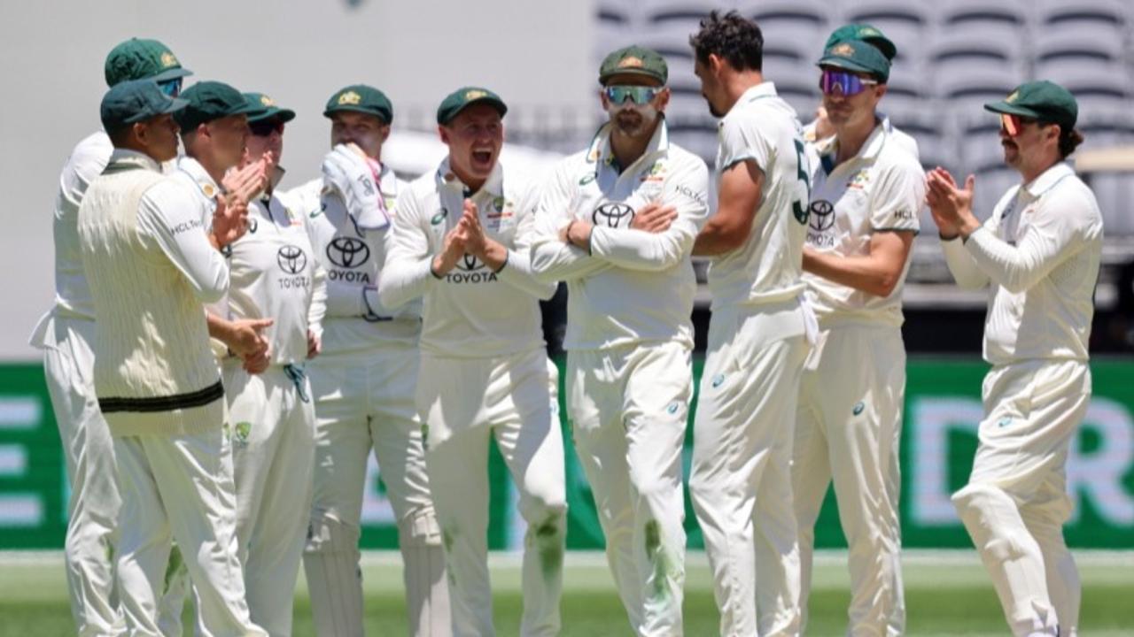 Australian team celebrates the fall of a wicket