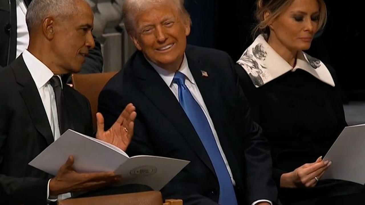 Barrack Obama and Donald Trump at Jimmy Carter's funeral.