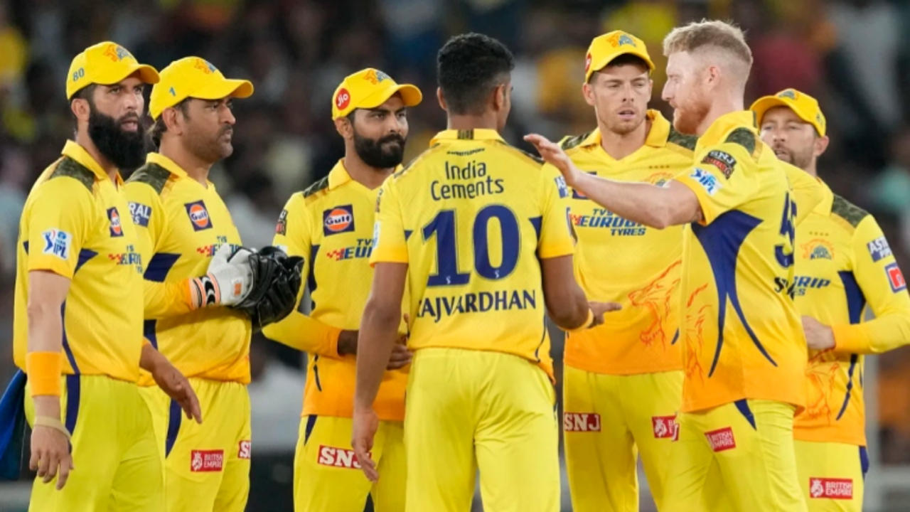 Chennai Super Kings players celebrate a fall of wicket