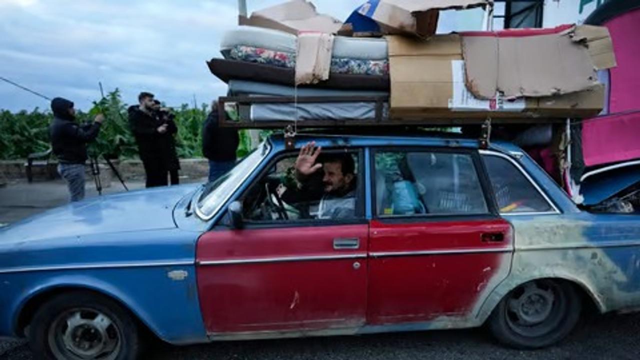 Displaced Lebanese heading back to their home. 