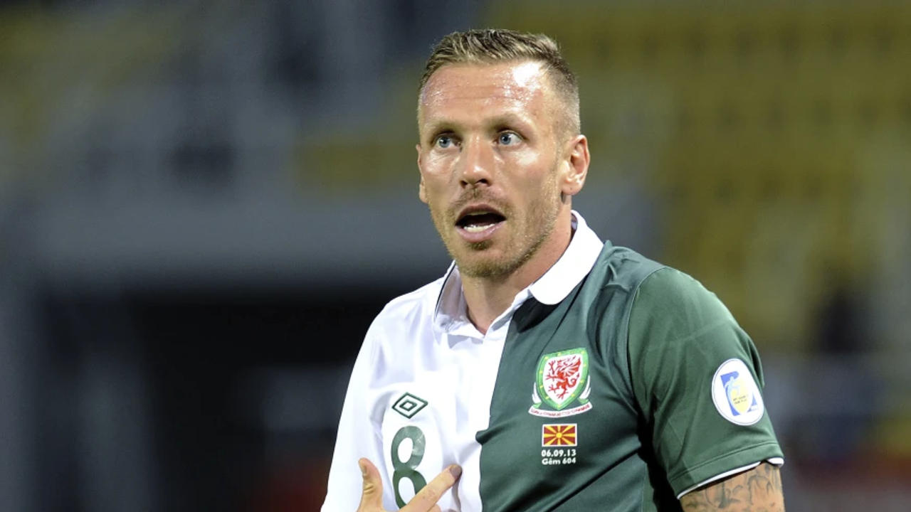 Former Wales captain Craig Bellamy was hired to coach the national team until 2028 on Tuesday.