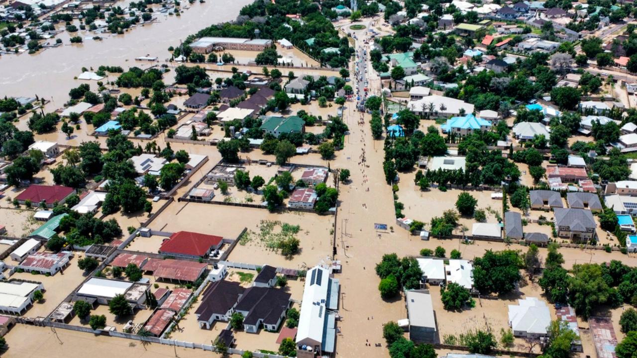 Houses are partially submerged following a dam collapse in Nigeria 