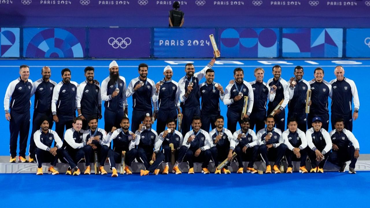 Indian men's hockey team pose with Bronze Medal at the Paris Olympics podium