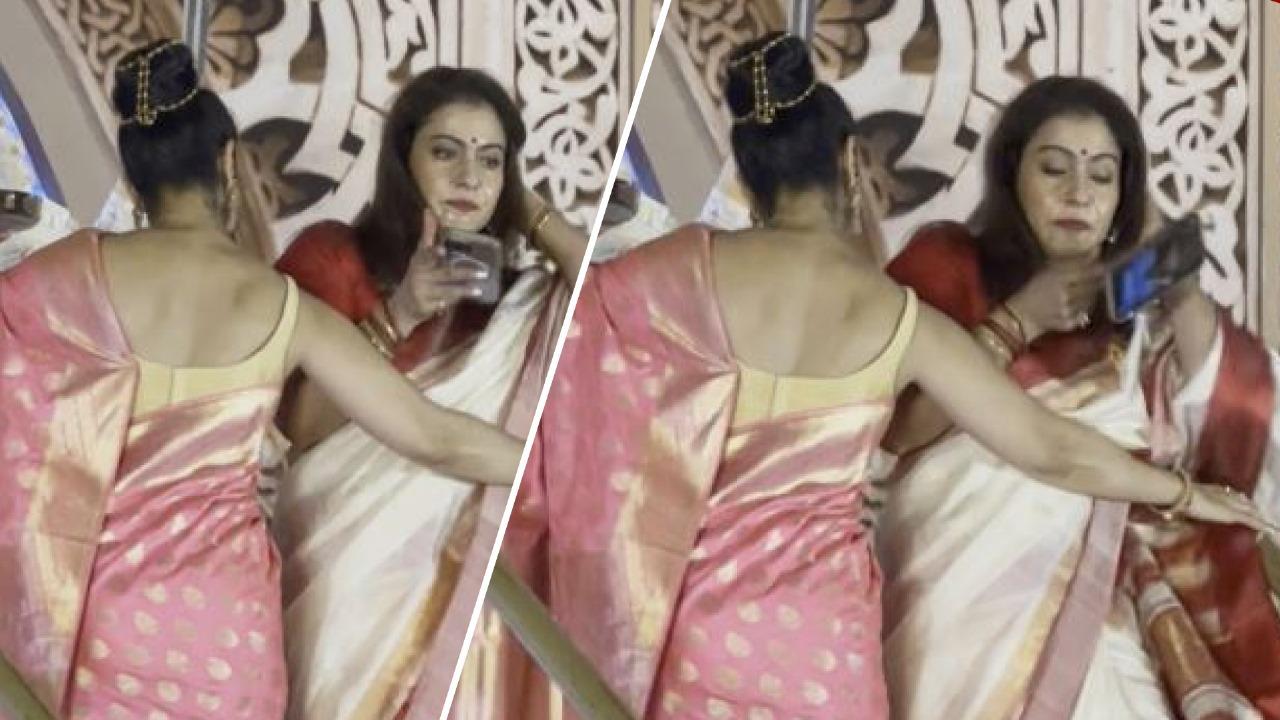 Kajol drops her phone at Durga Puja