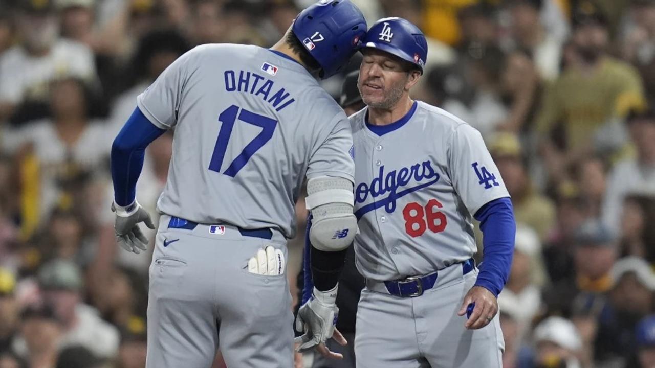 Los Angeles Dodgers’ Shohei Ohtani (17) celebrates with first base coach Clayton McCullough (86) 