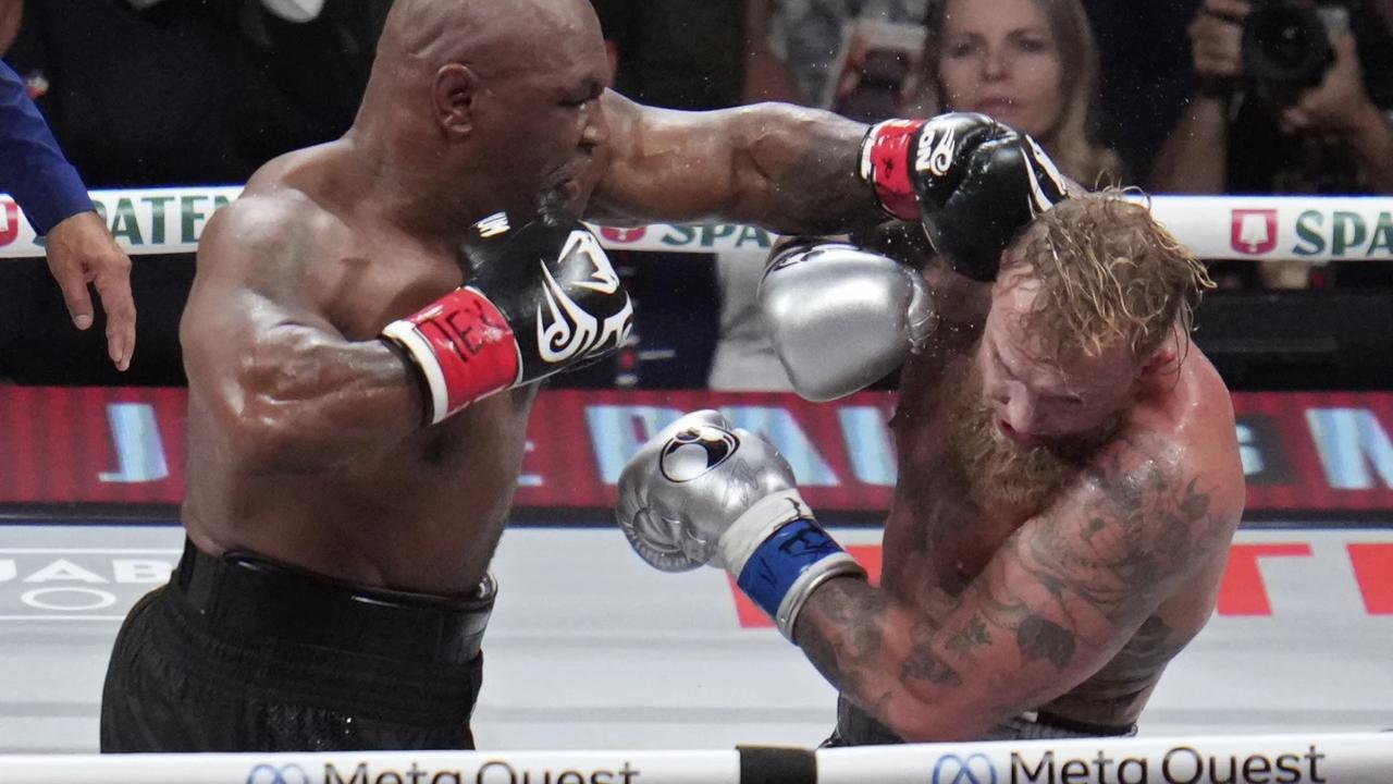 Mike Tyson lands a blow on Jake Paul