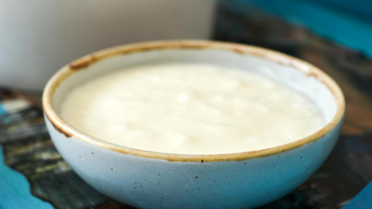 Mixing onion and curd. 