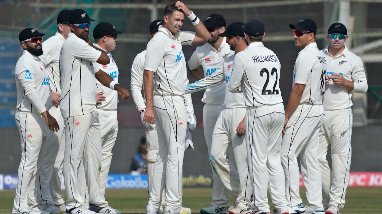 New Zealand team celebrates a fall of wicket