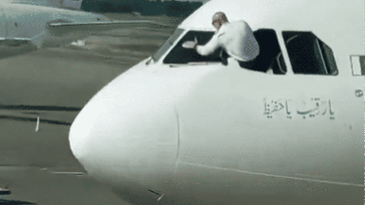 Pakistani airline pilot cleaning aircraft windsceen