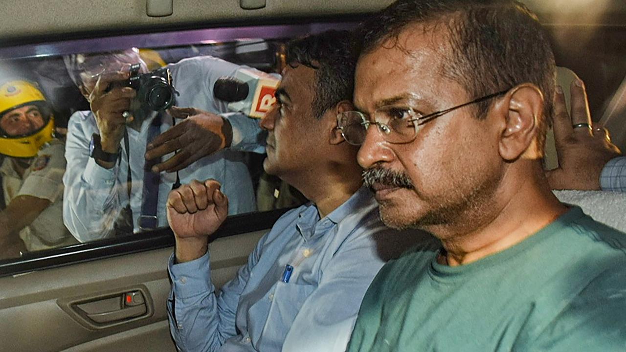 CBI officials leave with Delhi Chief Minister Arvind Kejriwal from the Rouse Avenue Court after the court sent him to the probe agency custody in the Excise policy case