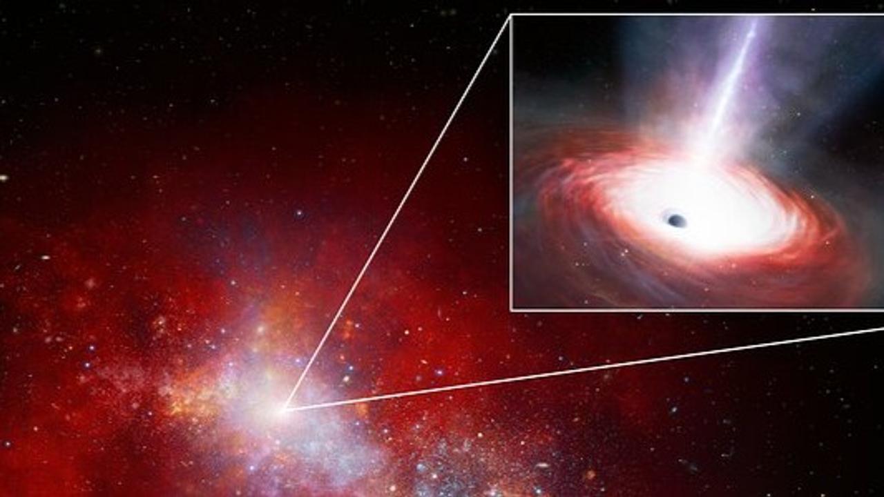 This artist’s rendition depicts a red, early-Universe dwarf galaxy with a rapidly feeding black hole at its core. Using data from NASA’s JWST and the Chandra X-ray Observatory. 