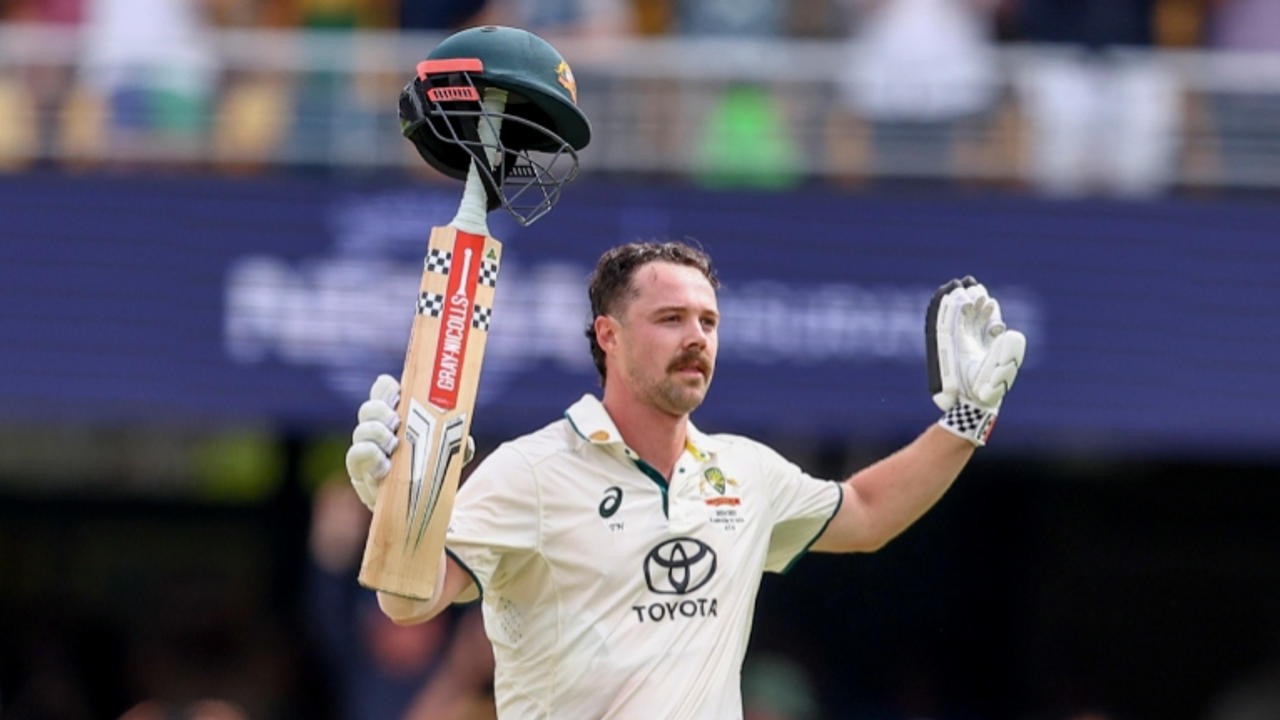 Travis Head celebrates his century