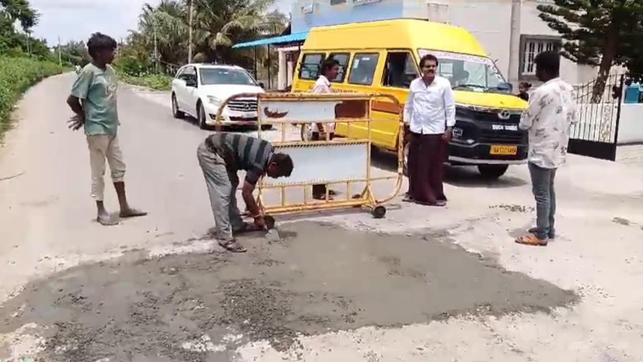 Vinod Raj spotted assisting lqabooures filling potholes.