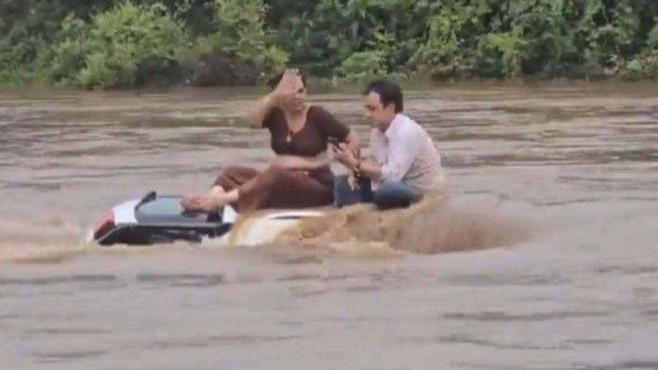 Viral Video Shows Couple Relaxing Atop Car Stuck In Floodwaters