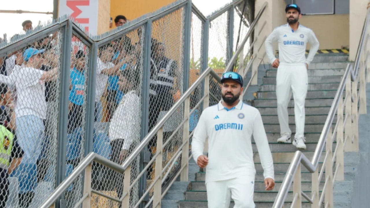 Virat Kohli and Rohit Sharma walk down the Wankhede stairs after loss to New Zealand in the third and the final Test