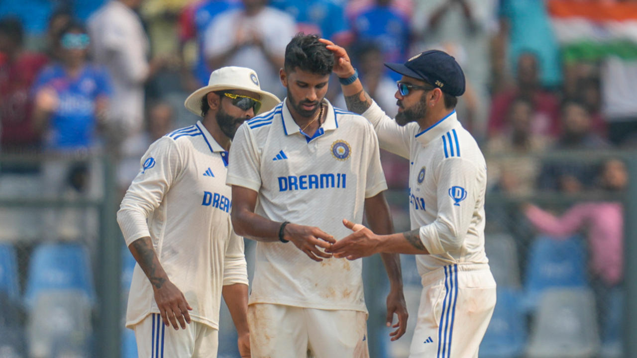 Washington Sundar, Virat Kohli, and Ravindra Jadeja 