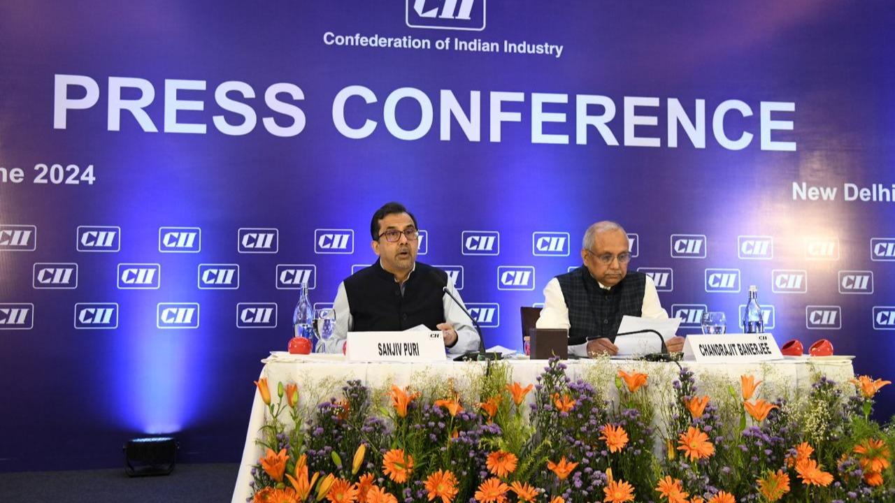 CII President Sanjiv Puri and DG Chandrajit Banerjee 