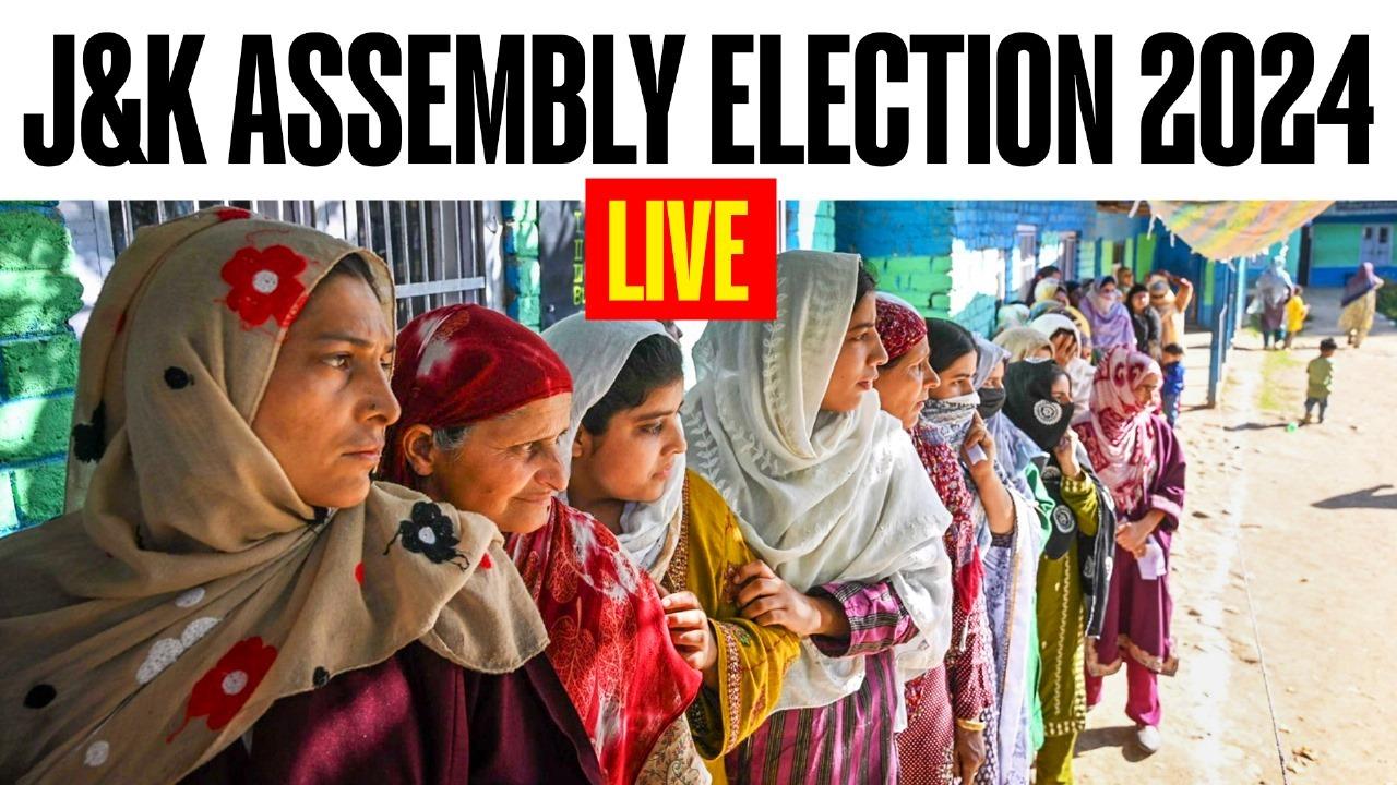 Women wait in a queue to cast his their votes at a polling booth during the first phase of Jammu and Kashmir Assembly elections, in Shopian district