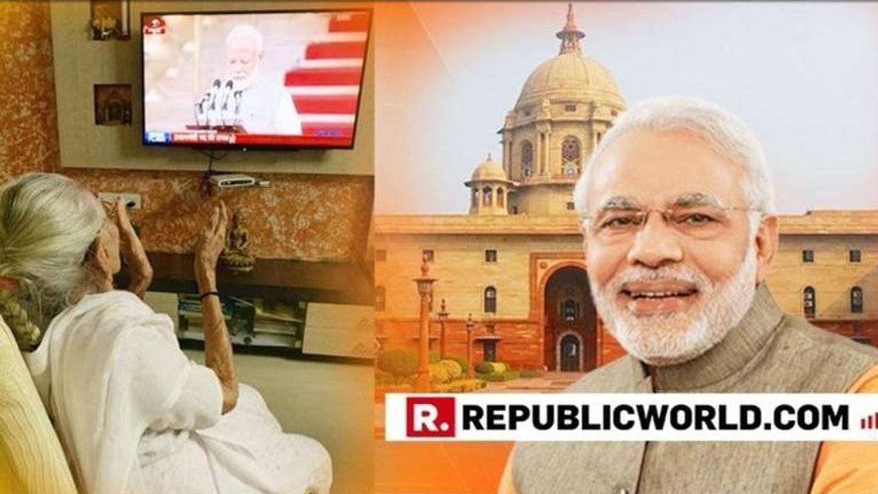 IN PICTURES | PM Modi's 99-year old mother, Heeraben Modi applauds as her son Narendra Modi takes oath as the Prime Minister of India