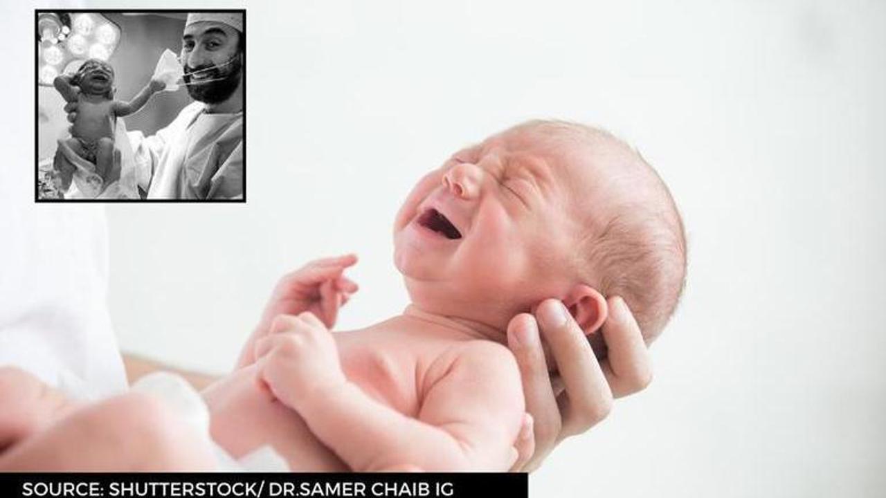 Baby Removing Doctor's Mask