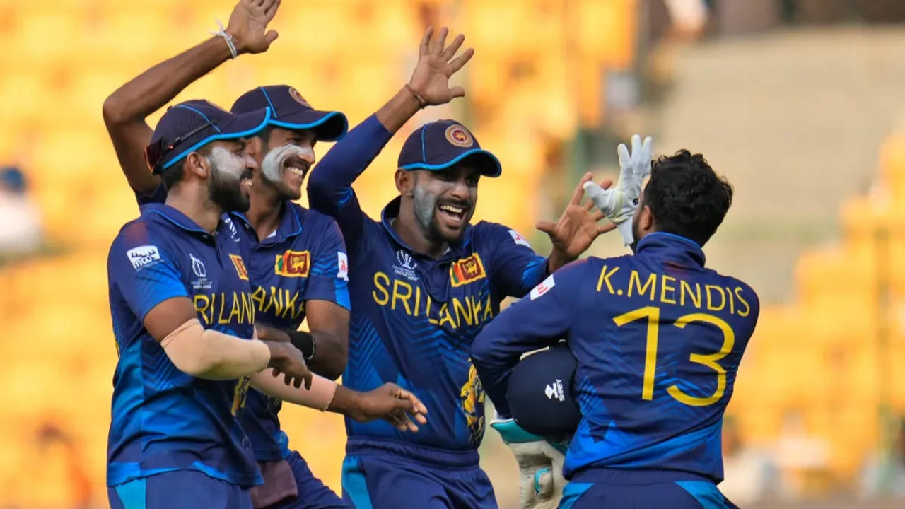 Kushal Mendis celebrates with his team after making a successful run-out attempt