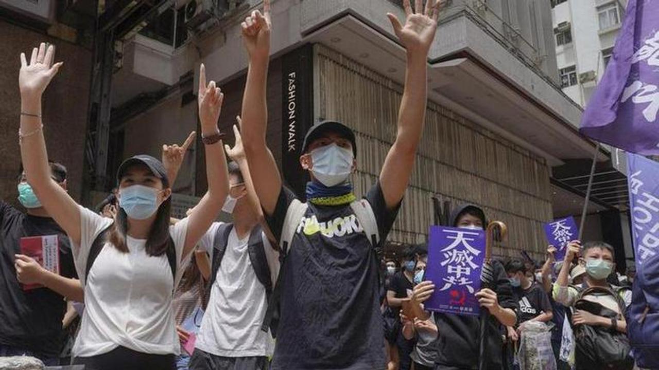 Hong Kong police fires tear gas on protesters, arrests activist