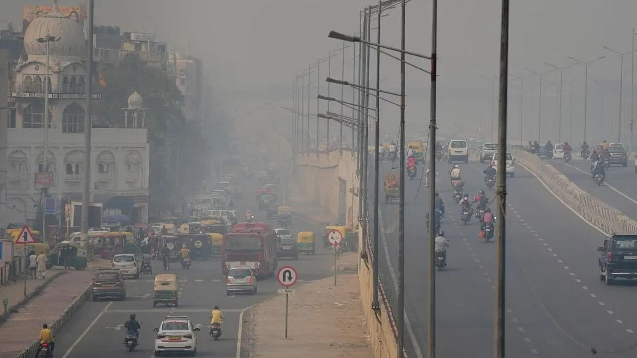 Vehicles ply amid smog at NH24 in New Delhi