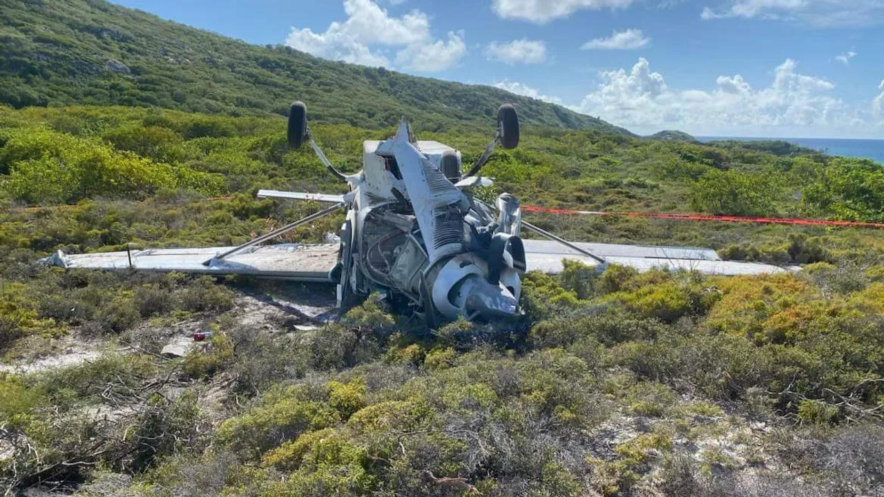 Four injured after plane flips while landing on Great Barrier Reef island