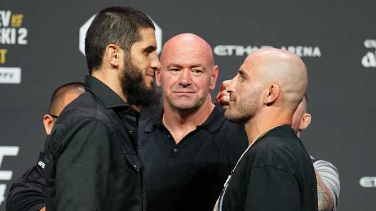  Islam Makhachev and Alexander Volkanovski face off as Dana White looks on