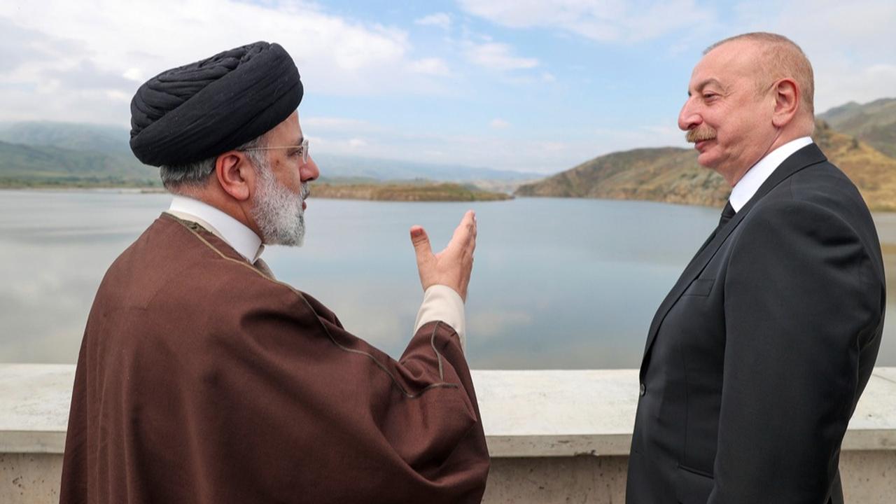 Iranian President Raisi speaking with his counterpart Ilham Aliyev during the inauguration of the Qiz Qalasi dam. 