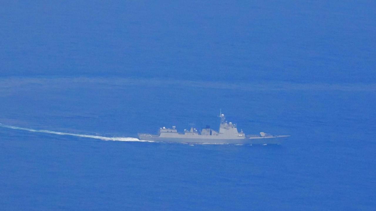 A photo released by the Taiwanese Defence Ministry shows a Chinese guided missile destroyer near the coast of the island nation. 