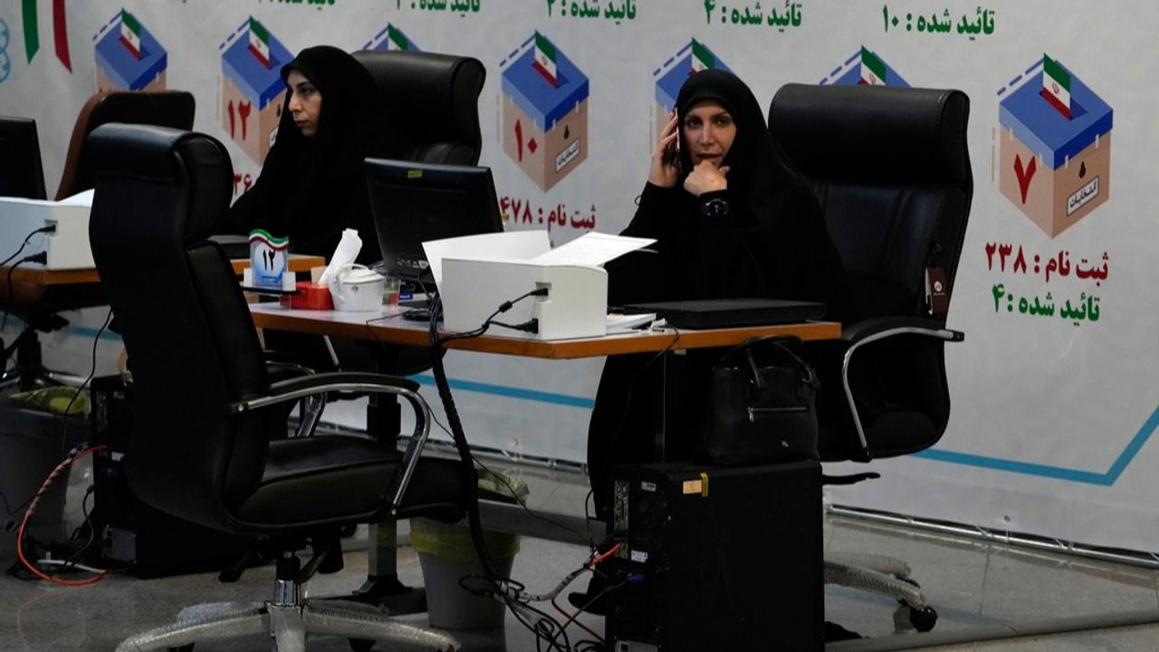 Iranian elections headquarters staff work to register candidates for the June 28 presidential elections at the Interior Ministry in Tehran.