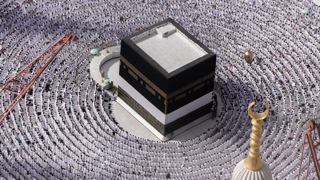 Muslim pilgrims pray around the Kaaba, the cubic building at the Grand Mosque, during the annual Hajj pilgrimage in Mecca, Saudi Arabia