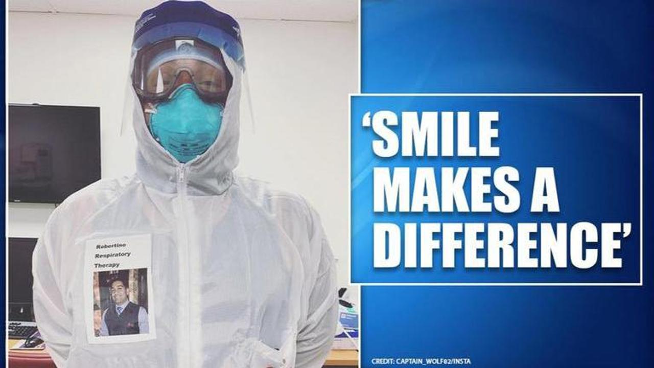 US doctor wears badge with his smiling face on it to comfort coronavirus patients