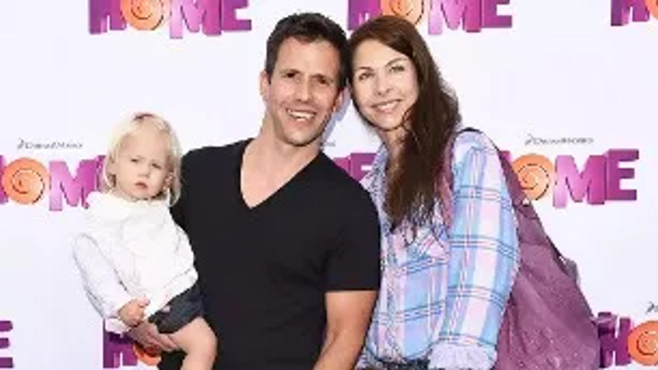 Christian Oliver with his wife and daughters