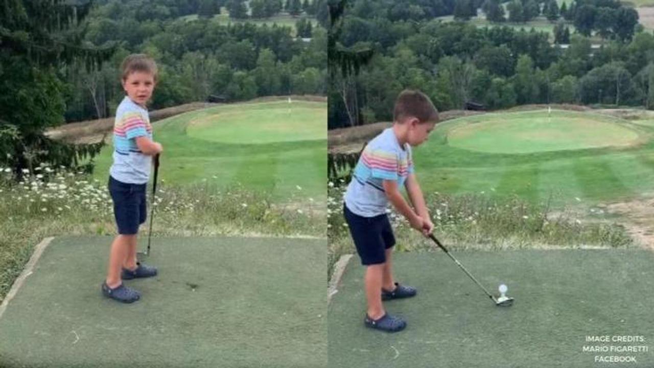 4 year old hits hole in one