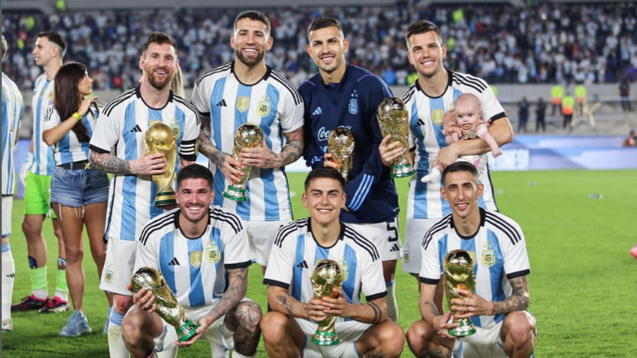 Angel di Maria with Argentina teammates including Messi after winning World Cup