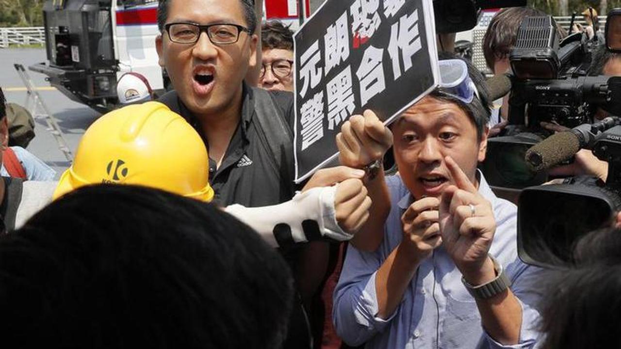 Hong Kong police arrest 2 opposition lawmakers over protests